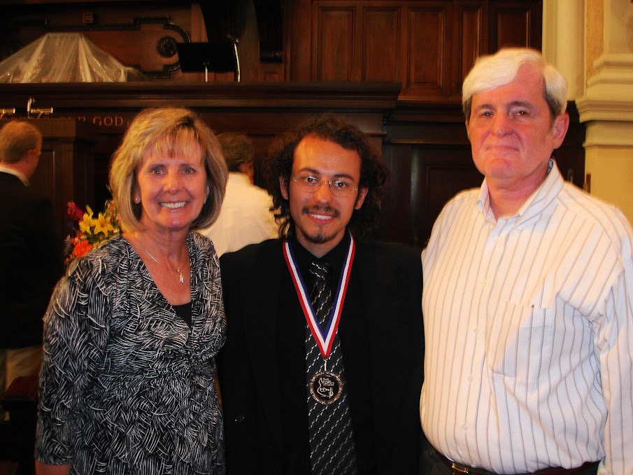 Dr. Costa with a competition medal after an international guitar competition